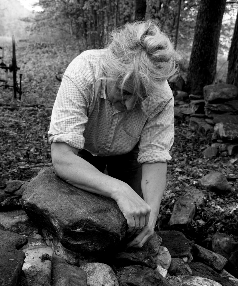 Portrait, stone wall, repair, hard work, Woman farmer, manual labor, hand built, working alone, working the land, VT