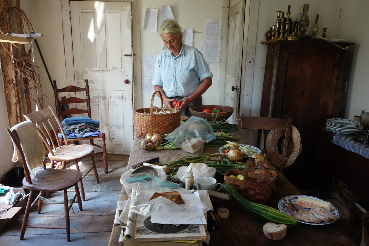 Environmental portrait, Vegetable preparation, tomatoes, woman farmer, rural, Vermont farmhouse, simple life, traditional, hard work, rustic, table, old chairs, Vermont, Vershire