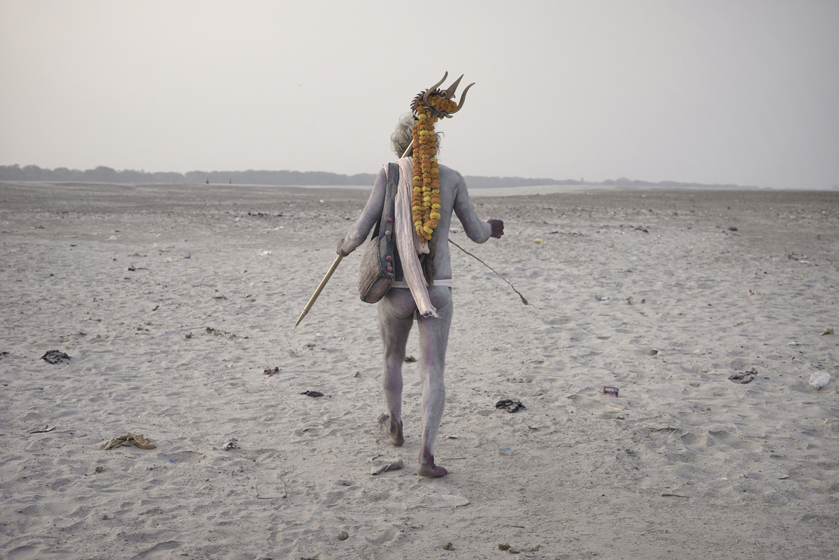 naked, holy man, ashes on skin, trident, marigolds, Varanasi, India
